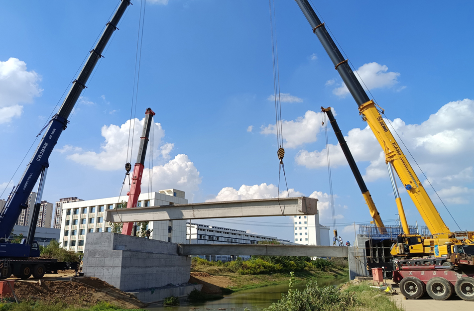 深南互通立交項目完成跨渠橋關(guān)鍵梁體吊裝 6片大型箱梁精準安裝 深南互通立交項目完成跨渠橋關(guān)鍵梁體吊裝 6片大型箱梁精準安裝